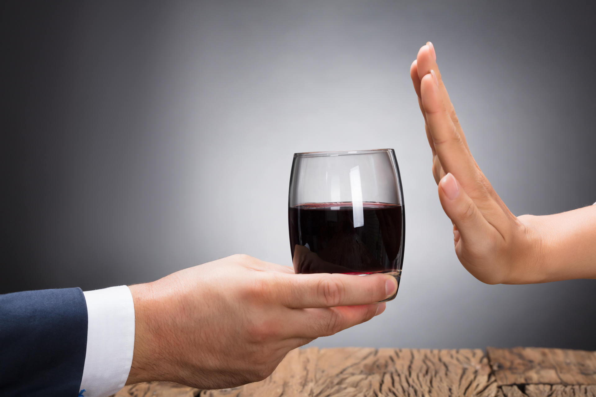 Businessperson Rejecting Glass Of Whiskey